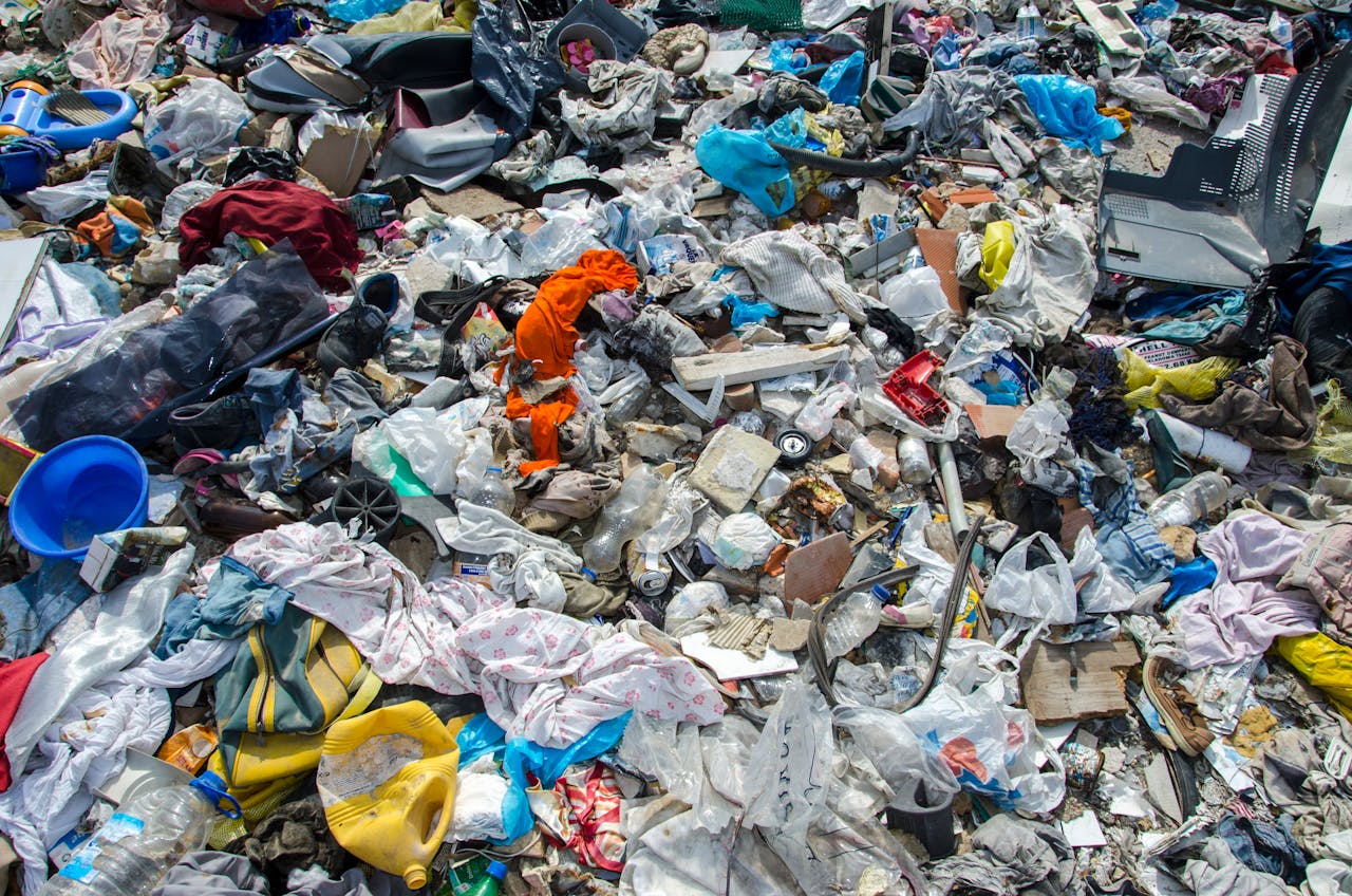 About A variety of waste materials scattered at a landfill, highlighting environmental concerns.